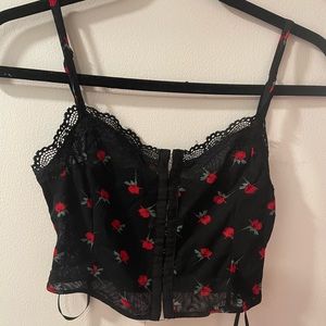 Mesh rose-print Princess Polly tank top. Hook-and-eye closure in the front